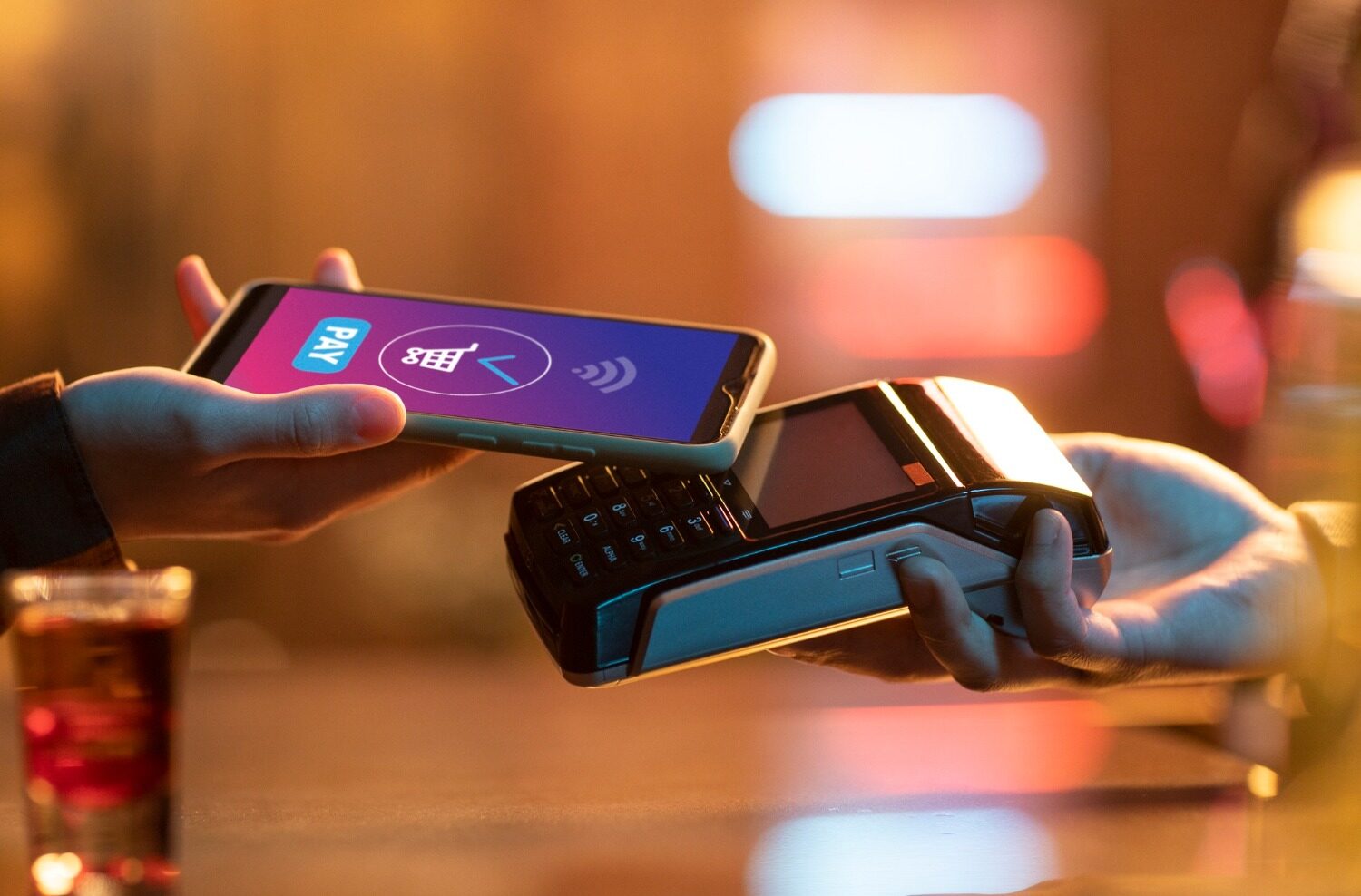 side view adult paying with card